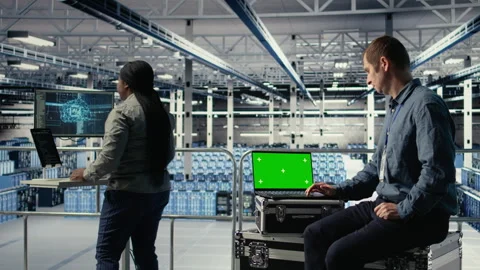 Data center admin investigates AI configurations using laptop Stock Footage 314683625