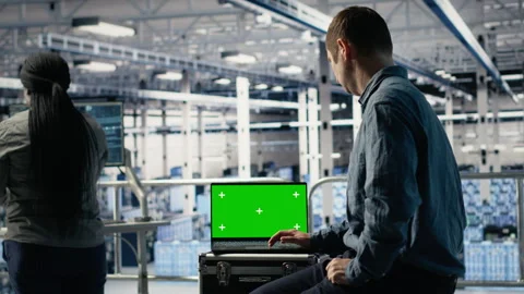 Data center admin investigates AI configurations using laptop Stock Footage 314803200