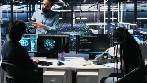 Data center admin receiving phone call, using AI assistant for tech support Stock Footage 313569969