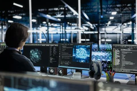 Data center admin running simulations for AI driven forecasting Stock Photos