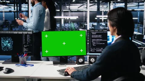 Data center admin typing on isolated screen PC keyboard, using AI Stock Footage 313567196