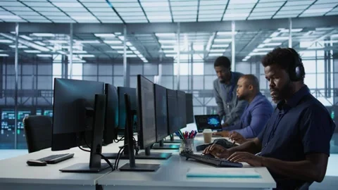 Data center admin typing on keyboard, maintaining company infrastructure Stock Footage 319574623