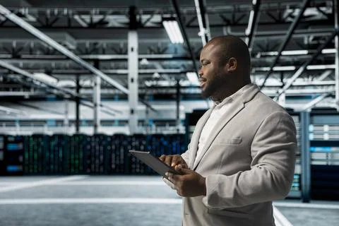 Data center admin updating systems to keeps performance up Stock Photos