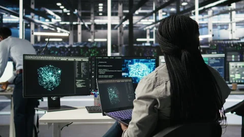 Data center admin uses AI technology on laptop for machine learning workloads Stock Footage 307040060