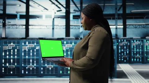 Data center admin uses isolated screen laptop to develop disaster recovery plans Stock Footage 317204328