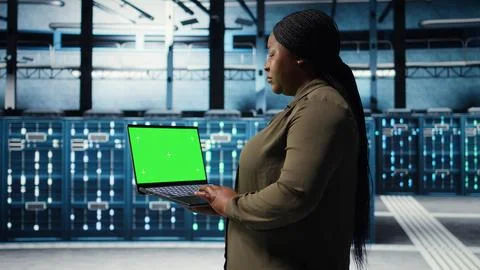 Data center admin uses isolated screen laptop to develop disaster recovery plans Stock Photos
