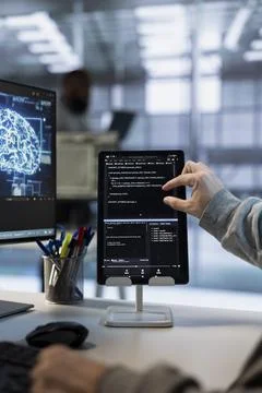 Data center admin uses machine learning applications on tablet Stock Photos