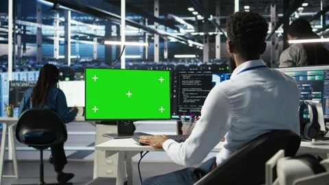 Data center admin using AI node tree software on isolated screen PC Stock Footage 309128887