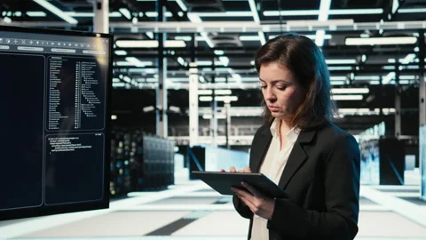 Data center admin using AI LLM model and AR control panel to configure rigs Stock Footage 329327120