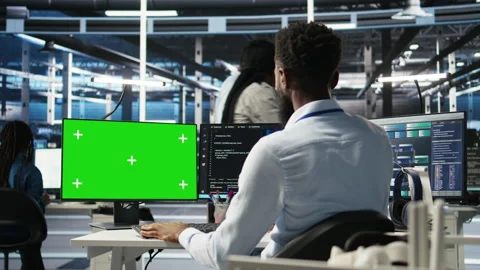 Data center admin using green screen PC to do node tree programming Stock Footage 307018680
