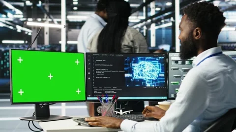 Data center admin using green screen PC to do node tree programming Stock Footage 309507538