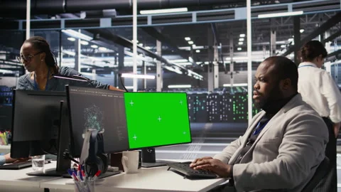 Data center admin using isolated screen PC to monitor neural network AI Stock Footage 309640194