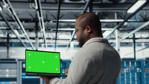 Data center admin using isolated screen laptop to monitor neural network AI 스톡 사진