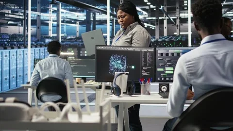 Data center admin using laptop to do node tree programming Stock Footage 309120330