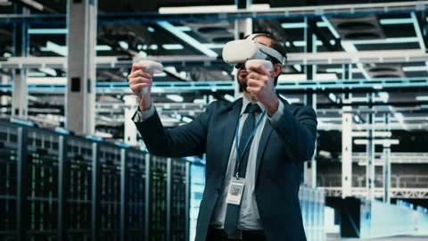 Data center admin using virtual reality simulation technology to monitor systems Stock Footage 329651899