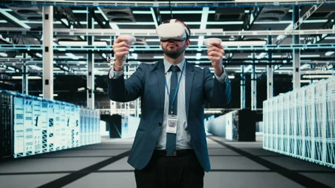 Data center admin using virtual reality simulation technology to monitor systems Stock Footage 329652528