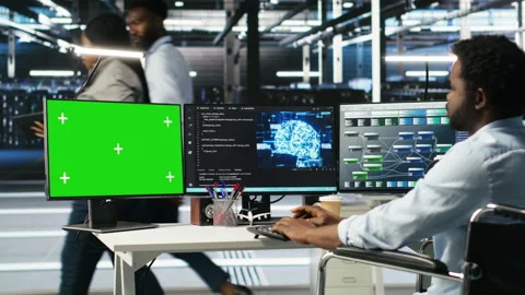 Data center admin in wheelchair using AI node tree software on green screen PC Stock Footage 307335342