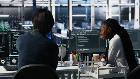 Data center admins doing brainstorming, working on neural network software Stock Footage 313567168