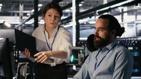 Data center admins working together, collaborating on AI software development Stock Footage 309637712