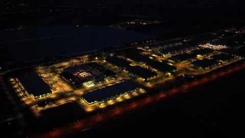 Data center and cloud computing hub at night aerial view Stock Footage 340350059