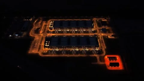 Data center and cooling towers at night, aerial view Stock Footage 340350073