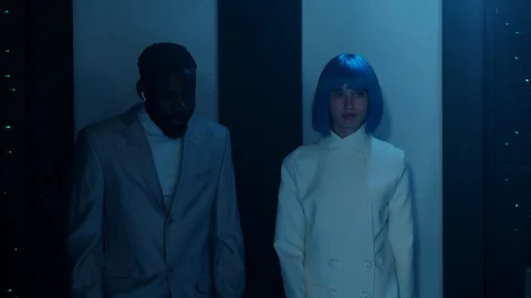 Data center blackout. Multi-ethnic future IT workers running in database under Stock Footage 121122665