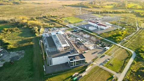 Data center building construction with electrical substation at sunset Stock-Fotos