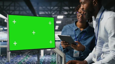 Data center colleagues working on green screen PC, updating infrastructure Stock Footage 310783206