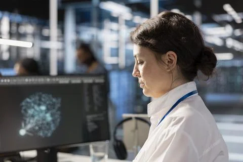 Data center computer scientist analyzing software logs metrics on PC Stock Photos