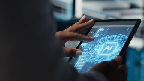 Data center computer scientist coding on laptop, doing software updates Stock Photos