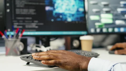 Data center computer scientist at desk using AI deep learning algorithms Stockbeeldmateriaal 307318177
