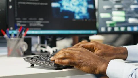 Data center computer scientist at desk using AI deep learning algorithms Stock Photos