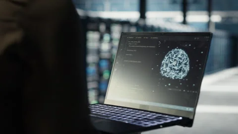 Data center computer scientist doing AI data analysis on laptop Stock Footage 317126673
