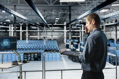 Data center computer scientist reviewing code for AI automation scripts Stock Photos