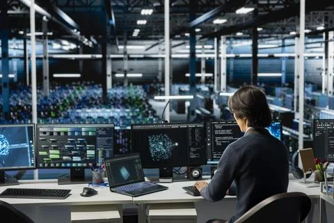 Data center computer scientist running simulations for AI forecasting Stock Photos