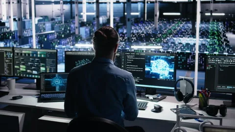 Data center computer scientist using PC to monitor neural network using AI LLM Stock Footage 313570343