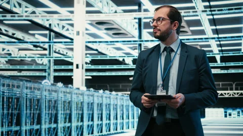 Data center computer scientist using tablet app, managing equipment Stock Footage 329721413