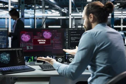 Data center computer scientist using AI LLM assistant to fix critical errors Stock Photos