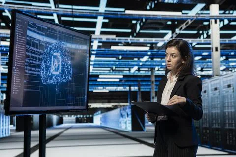 Data center computer scientist using AI to troubleshoot backend operations gear Stock Photos