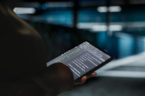 Data center computer scientist using tablet to optimize network infrastructure Stock Photos