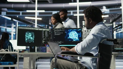 Data center computer scientist in wheelchair using AI node tree software 스톡 동영상 307037545