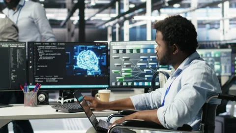 Data center computer scientist in wheelchair using AI node tree software Video stock 308046126