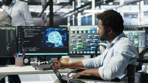 Data center computer scientist in wheelchair using AI node tree software Stock Footage 309127585