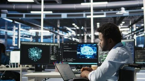 Data center computer scientist in wheelchair using AI node tree software 写真素材