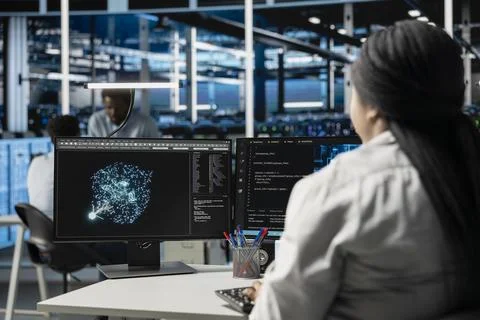 Data center computer scientist at work using machine learning algorithms Stock Photos