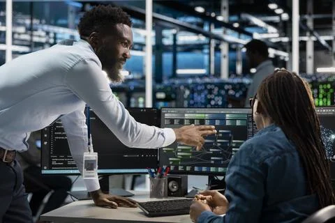 Data center computer scientists setting up machine learning node trees 写真素材