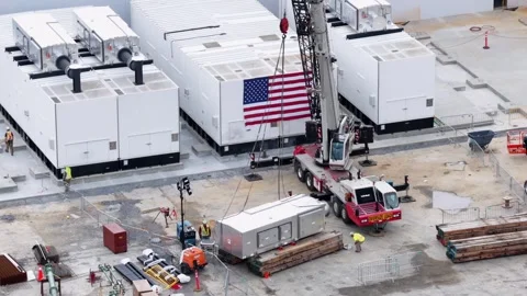 Data center construction site with large white cooling units, mobile crane Stock Footage 337691963