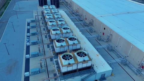 Data center cooling system units spinning on an industrial building in Ohio Stock Footage 345670440