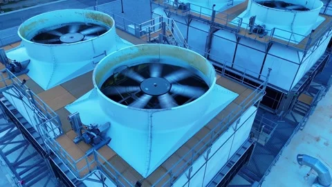 Data center cooling towers with spinning fans dissipating heat from computer Stock Footage 345670505