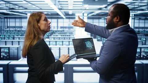 Data center coworkers doing yearly maintenance using laptop and tablet Stock Footage 277653972